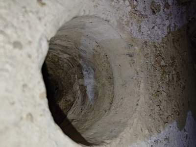 Visible holes and damage in the wall structure