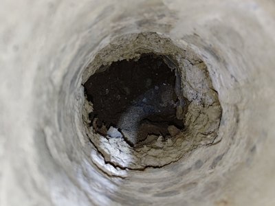 Cavity and damage uncovered behind wall structure