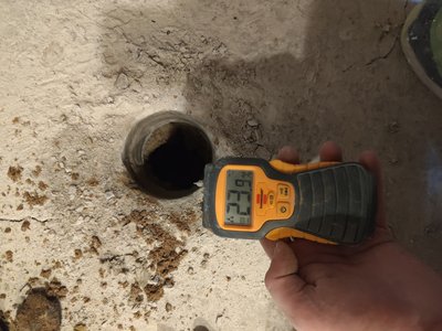 Moisture reading taken at the foundation