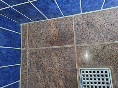 Bathroom with tile damage — insurance documentation