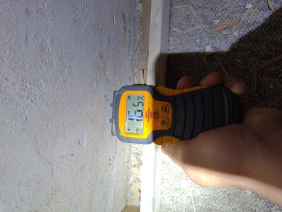 Moisture measurement on walls — elevated values documented