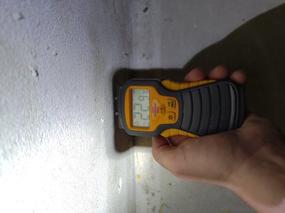Digital moisture meter used at the basement
