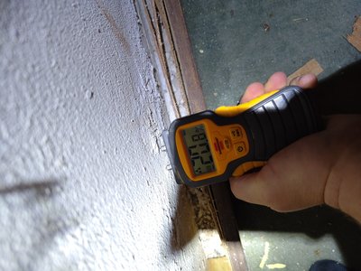 Moisture meter documenting condition of the basement