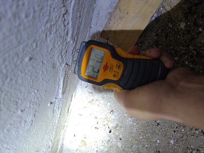 Close-up of moisture meter at the basement