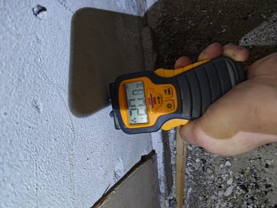 Moisture meter display showing value at the basement