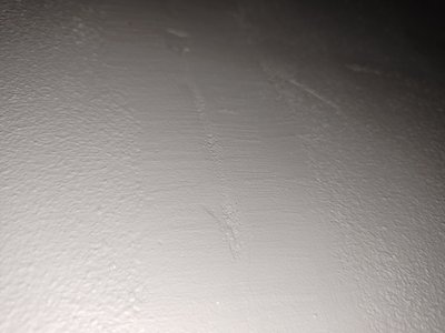 Wall with visible damage in the basement