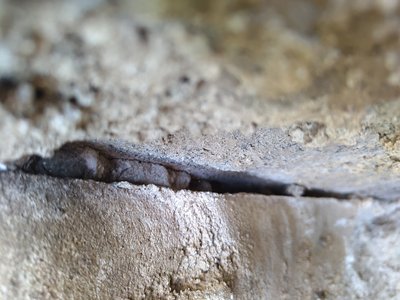 Wall with visible damage in the exterior wall