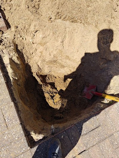 Asbestos-containing material in the excavation pit