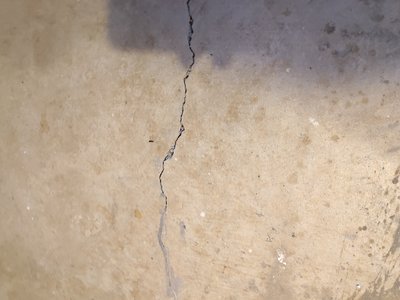 Floor with visible damage in the basement