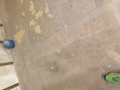 Floor condition documented in the basement